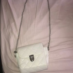 A White purse that has been worn twice